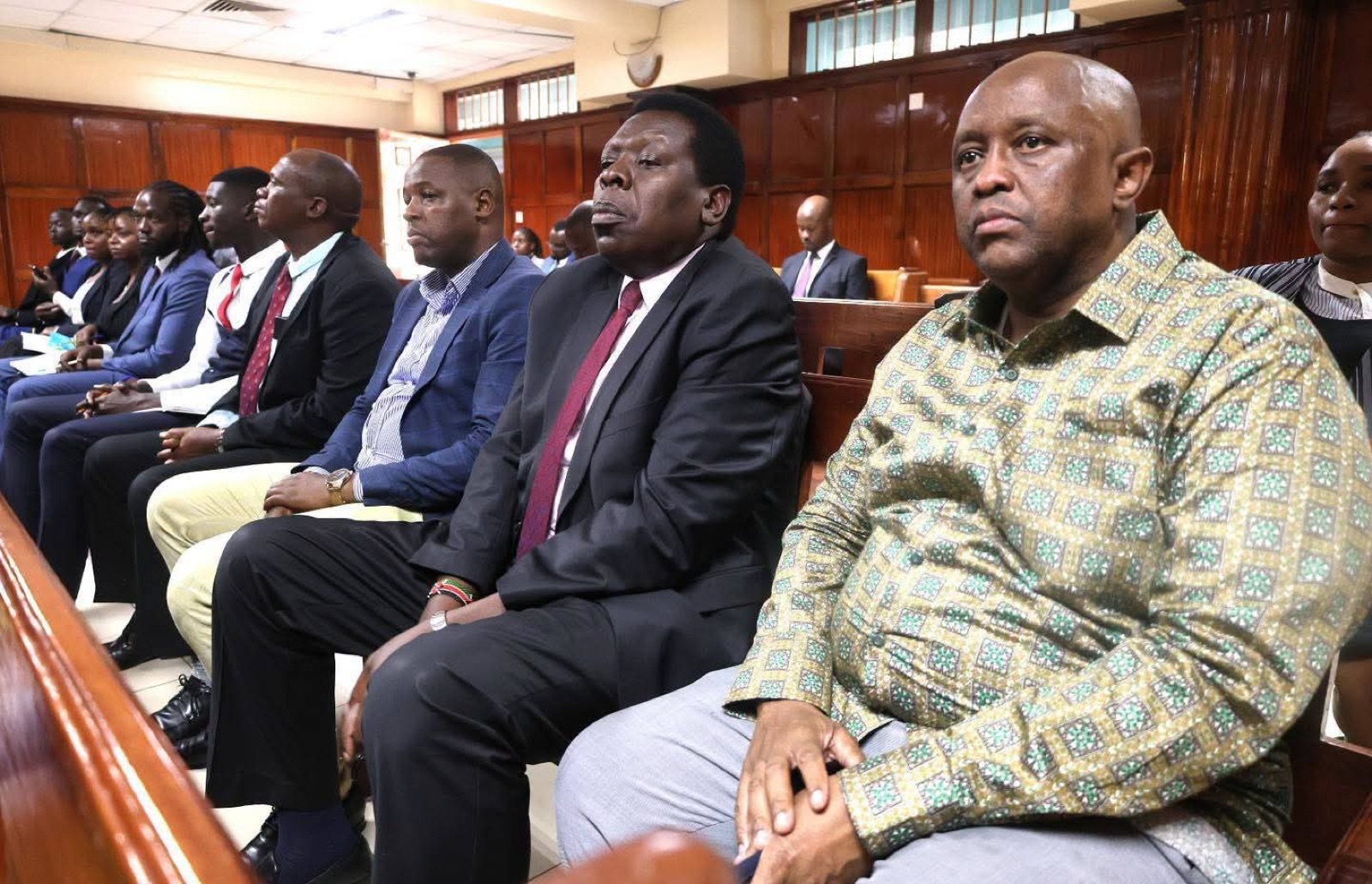 Leaders seated in court during the proceedings